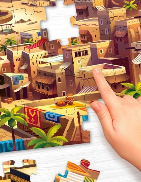 Un enfant en train de faire le puzzle de la Mecque - Big Puzzle Makkah